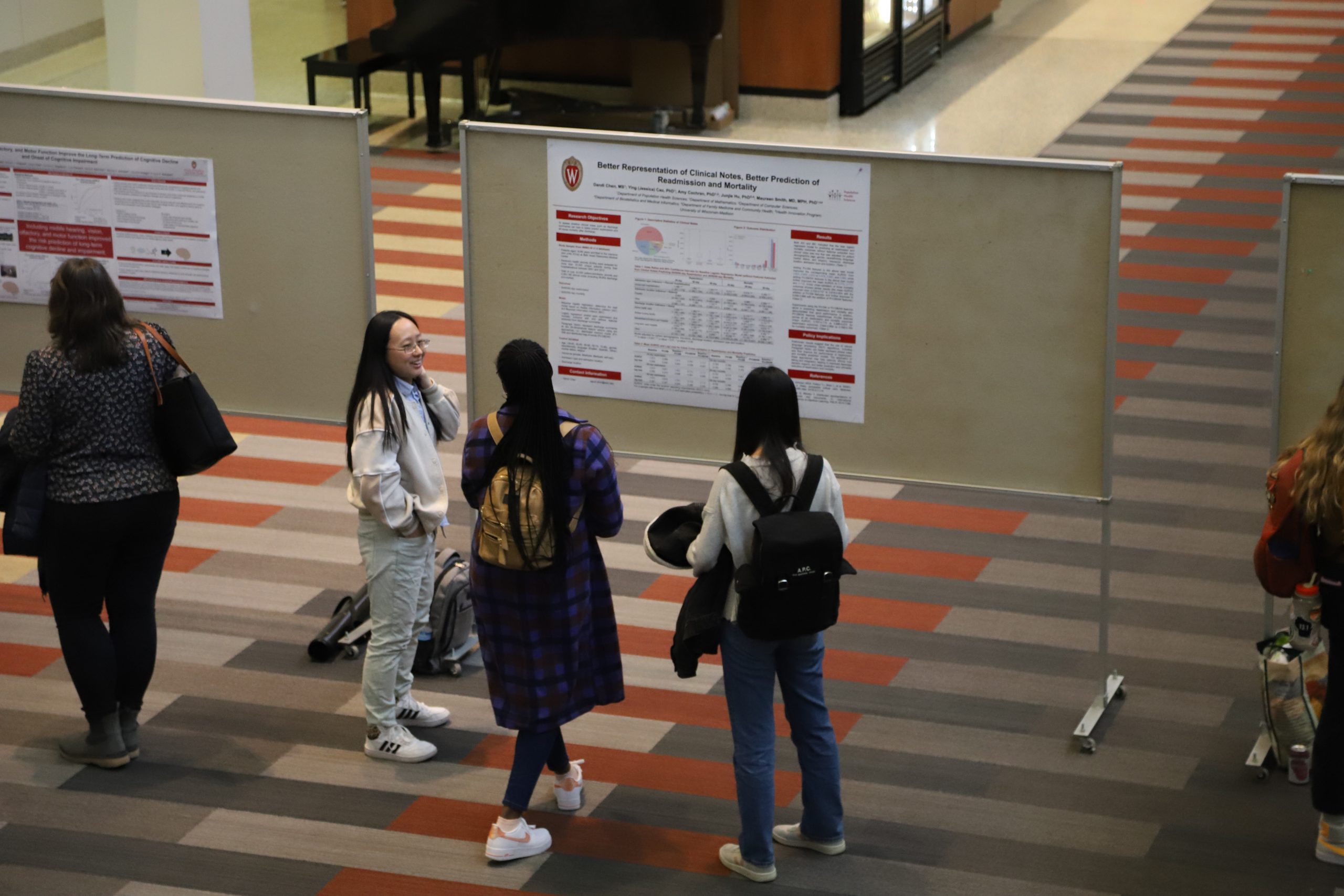 Students at a poster symposium.